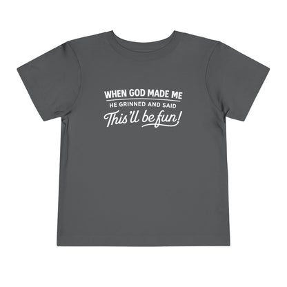 “When God made me he grinned and said , this’ll be fun” Toddler Tee