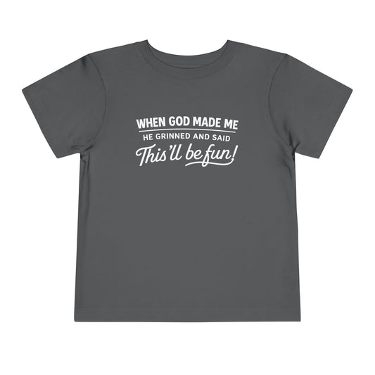 “When God made me he grinned and said , this’ll be fun” Toddler Tee