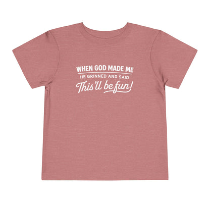 “When God made me he grinned and said , this’ll be fun” Toddler Tee
