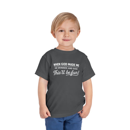 “When God made me he grinned and said , this’ll be fun” Toddler Tee